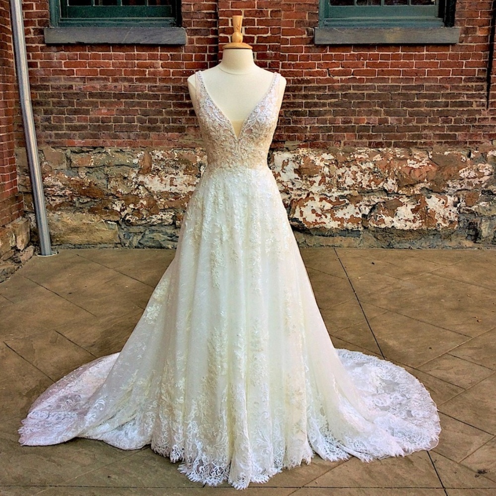 Lace and beaded wedding dress with train